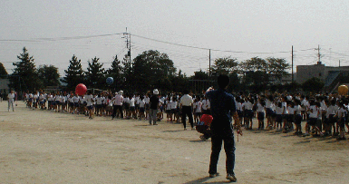 Elementary Kids Passing Large Colorful Balls